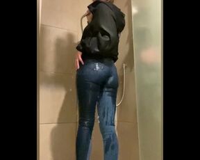 Girl showers in tight jeans