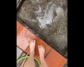 Feet playing in mud