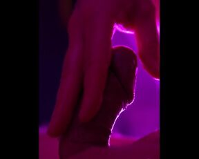 Solo groaning mastrubation with massive cumshot close-up in pink light