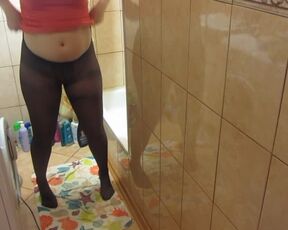 Pissing Standing Teen Girl taking off Nylon Tights