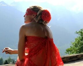 Sexy Beautiful Red Dressed Blonde Babe Smoking in Mountains Outdoor