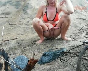 Public Peeing Teen Girl on the Beach