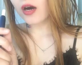 Asian redhead smokes