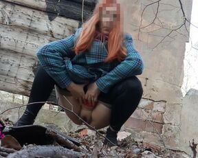 Desperate Redhead peeing in the forest ruins.