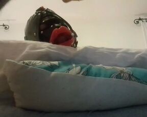 My wife is hogtied on the bed with an open gag on her mouth. I fucked her throat and cummed on her